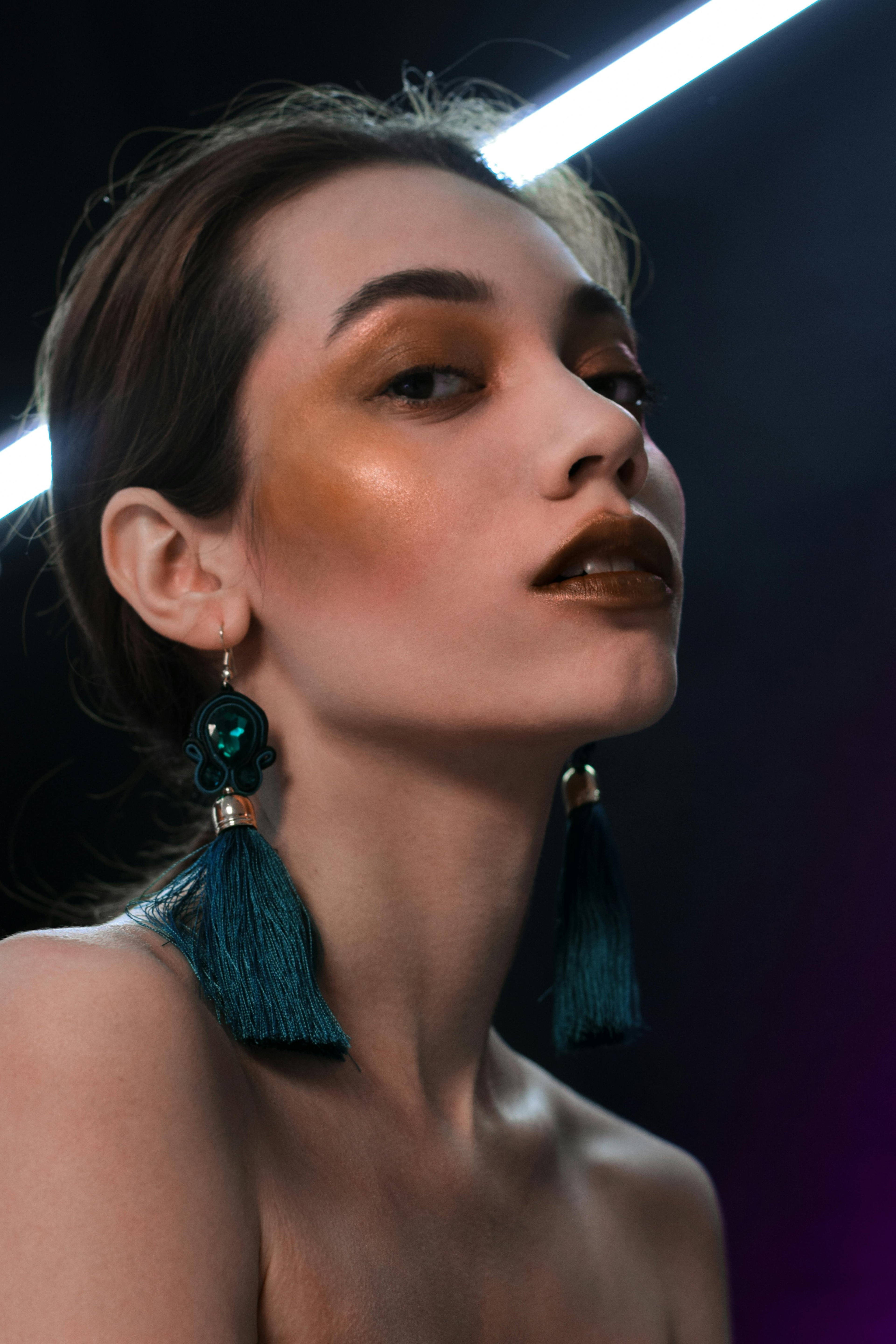 Elegant lightweight earrings for a Miami wedding guest 2026 — drop and tassel styles by AEVUM