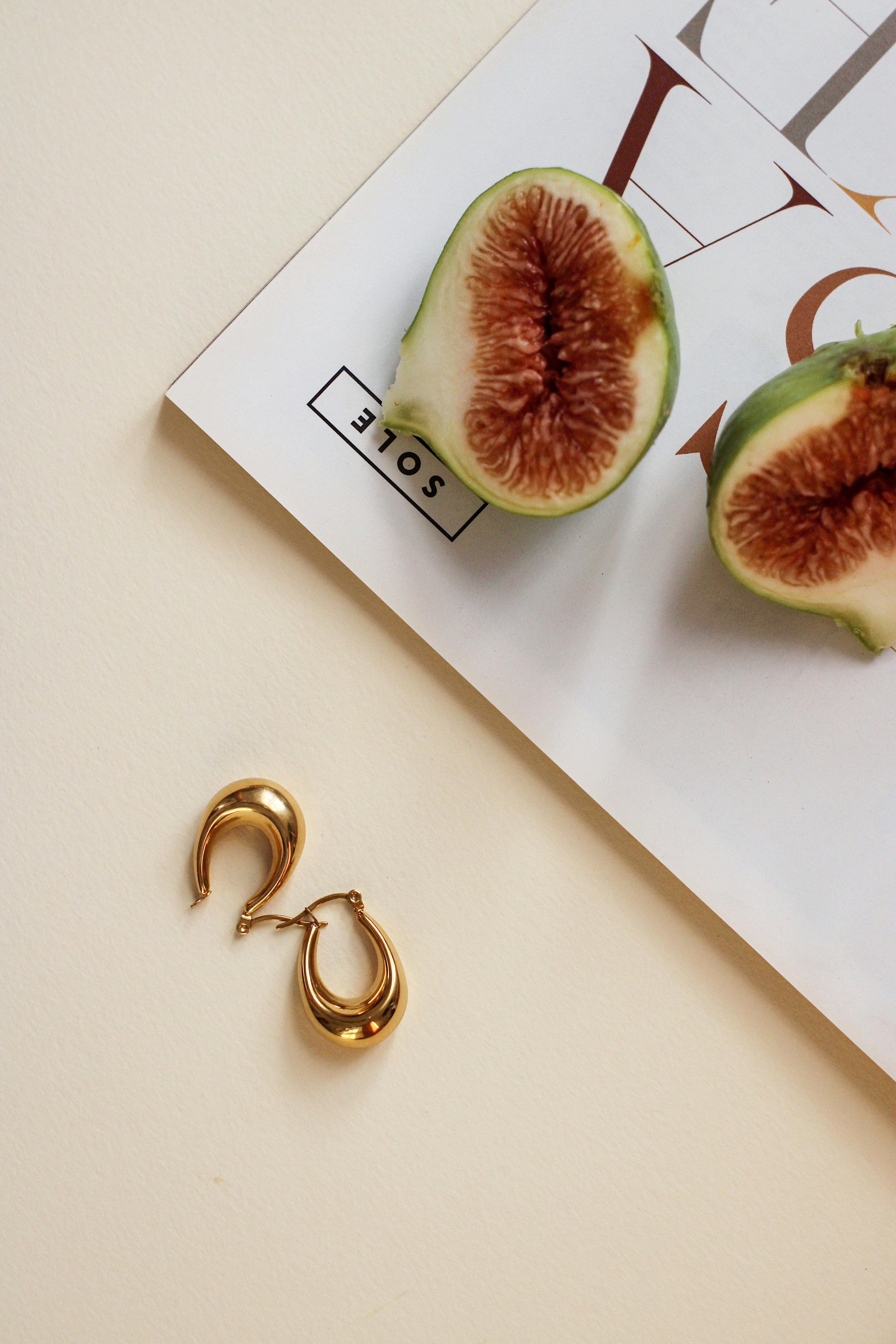 Woman wearing minimalist gold earrings — affordable luxury jewelry trend 2026