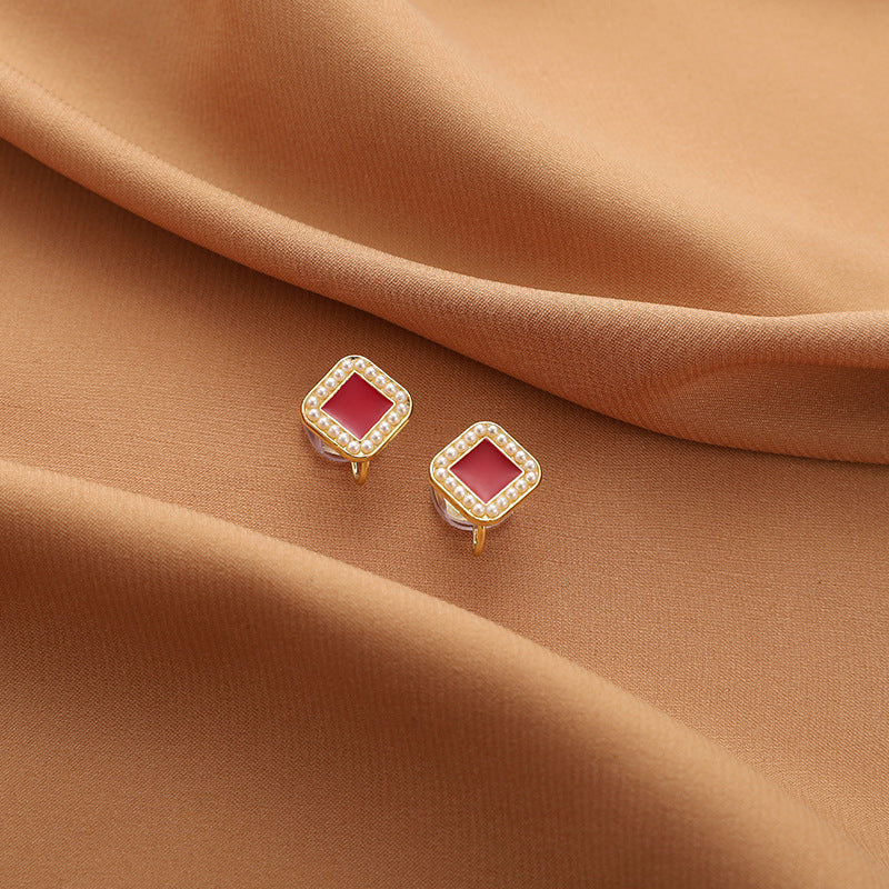 AEVUM clip-on earrings — comfortable no-piercing styles in pearl, floral and geometric designs
