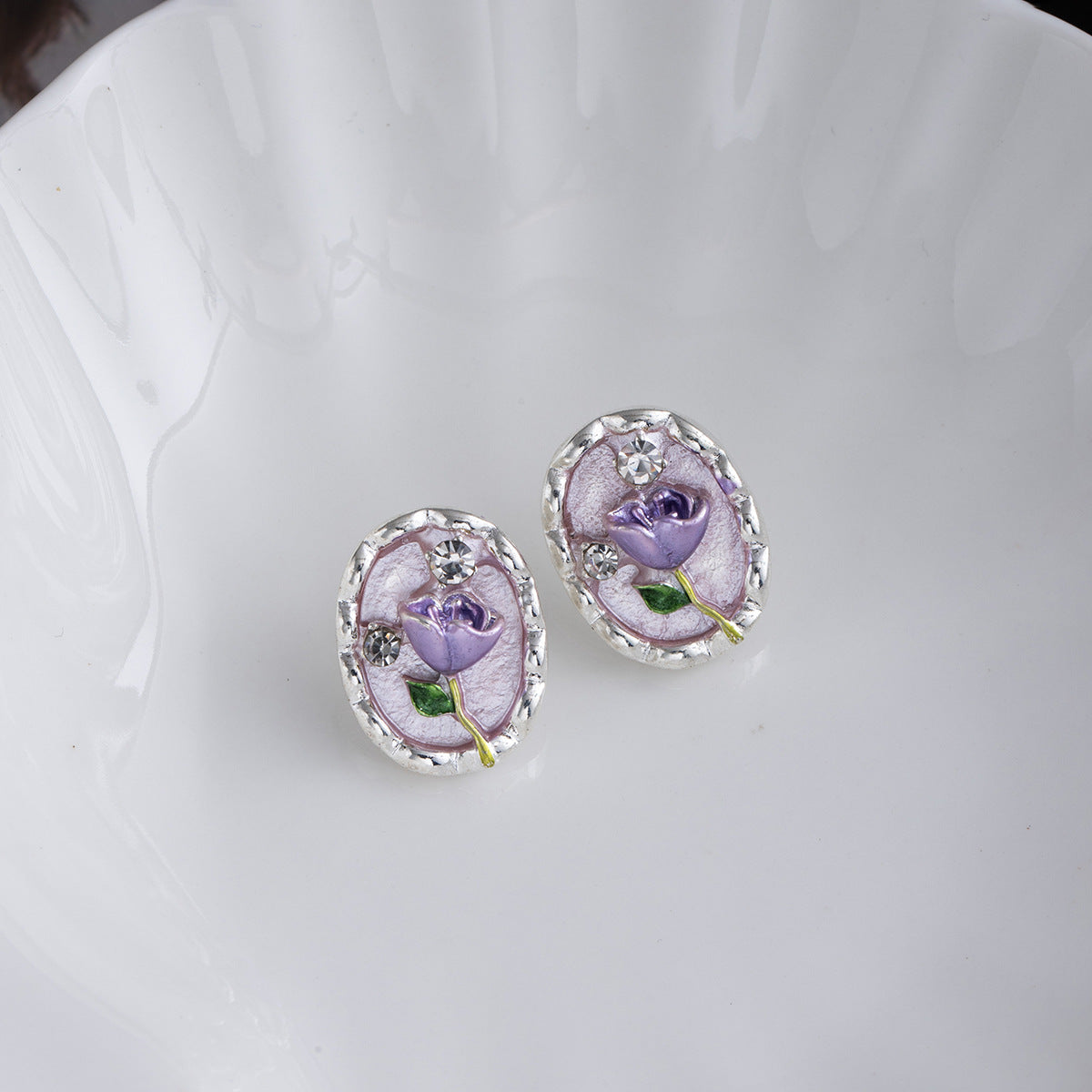 Monet Garden purple tulip earrings, vintage oil painting style on white dish